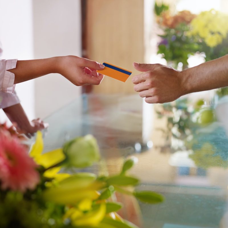 Client With Credit Card Shopping In Flowers Shop